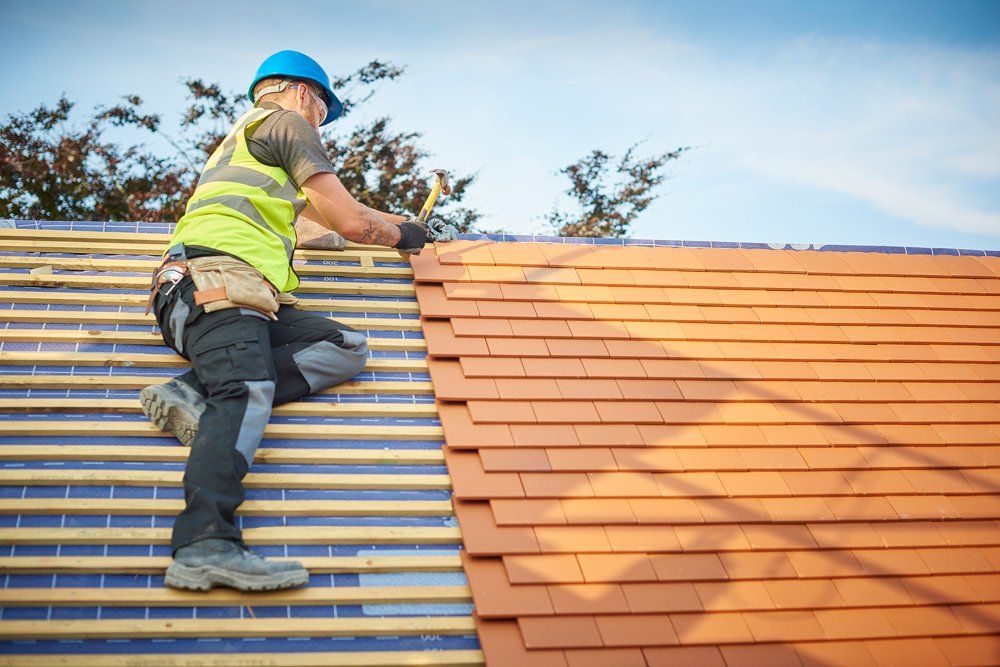 Installing New Roof Shingles — Carlsbad, NM — ENM Construction Management Ltd