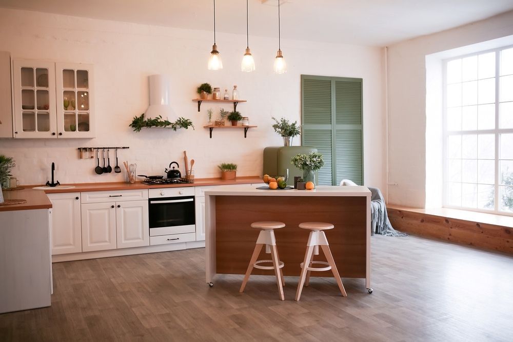 A Kitchen With A Wooden Island And Two Stools — O'Donnell Cabinetmaking in Gracemere, QLD