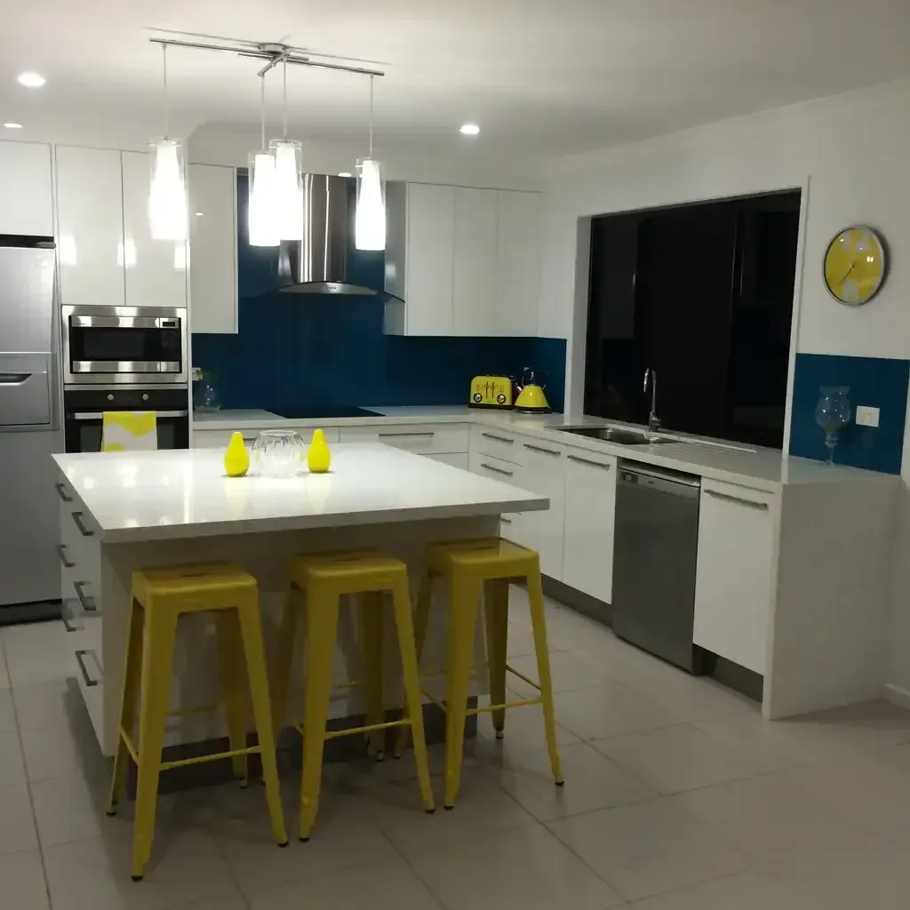 A Kitchen With White Cabinets And Yellow Stools — O'Donnell Cabinetmaking in Kawana, QLD