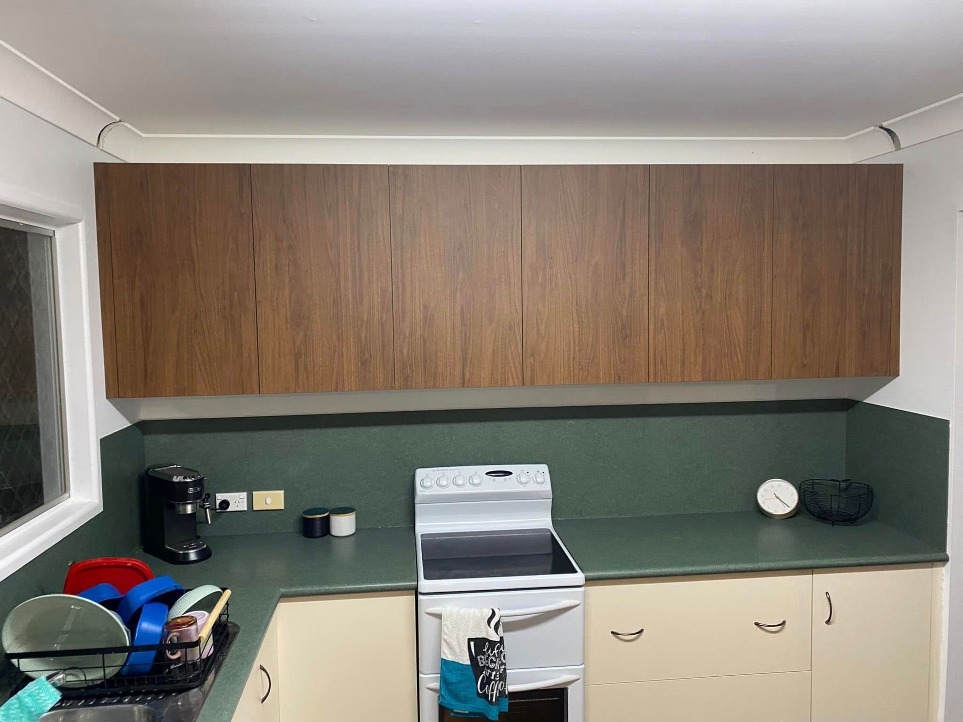 A Kitchen With A Stove , Sink , And Cabinets — O'Donnell Cabinetmaking in Kawana, QLD