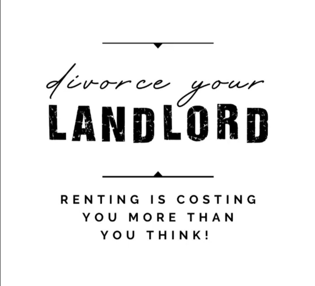 A dining room with a round table and chairs.