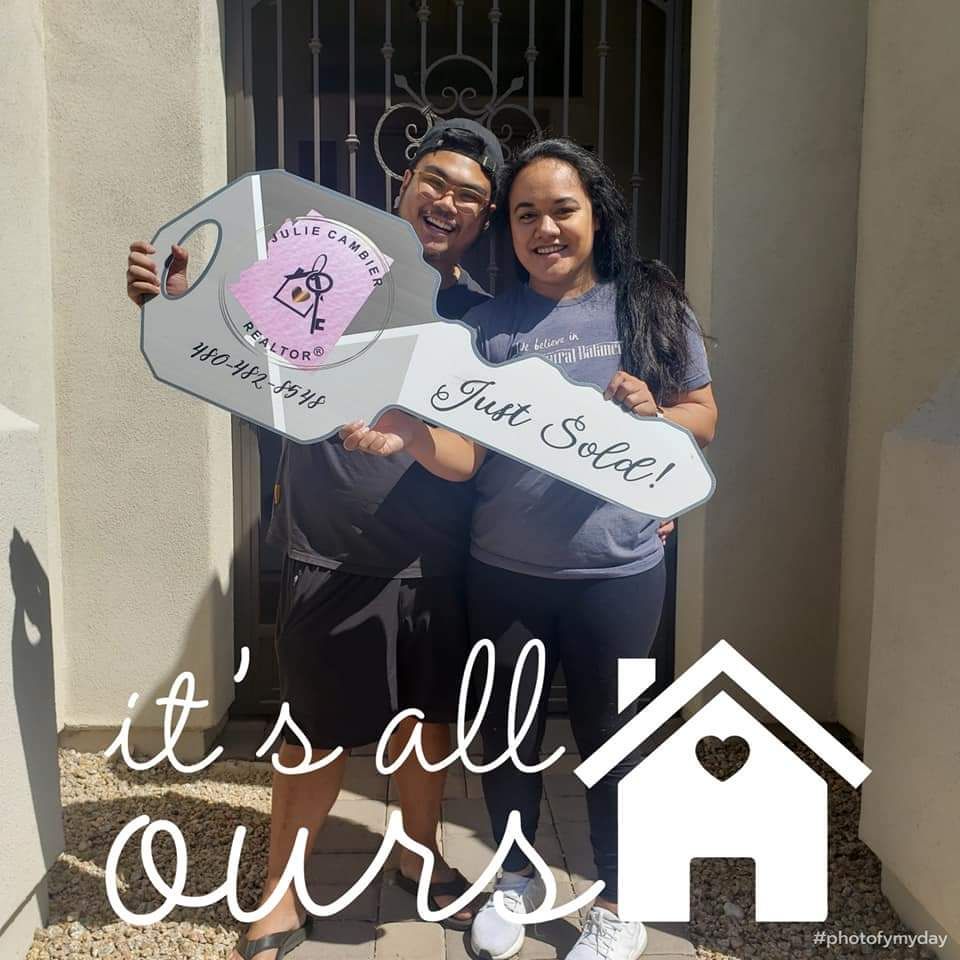 A vase of flowers is sitting on a table next to a window.