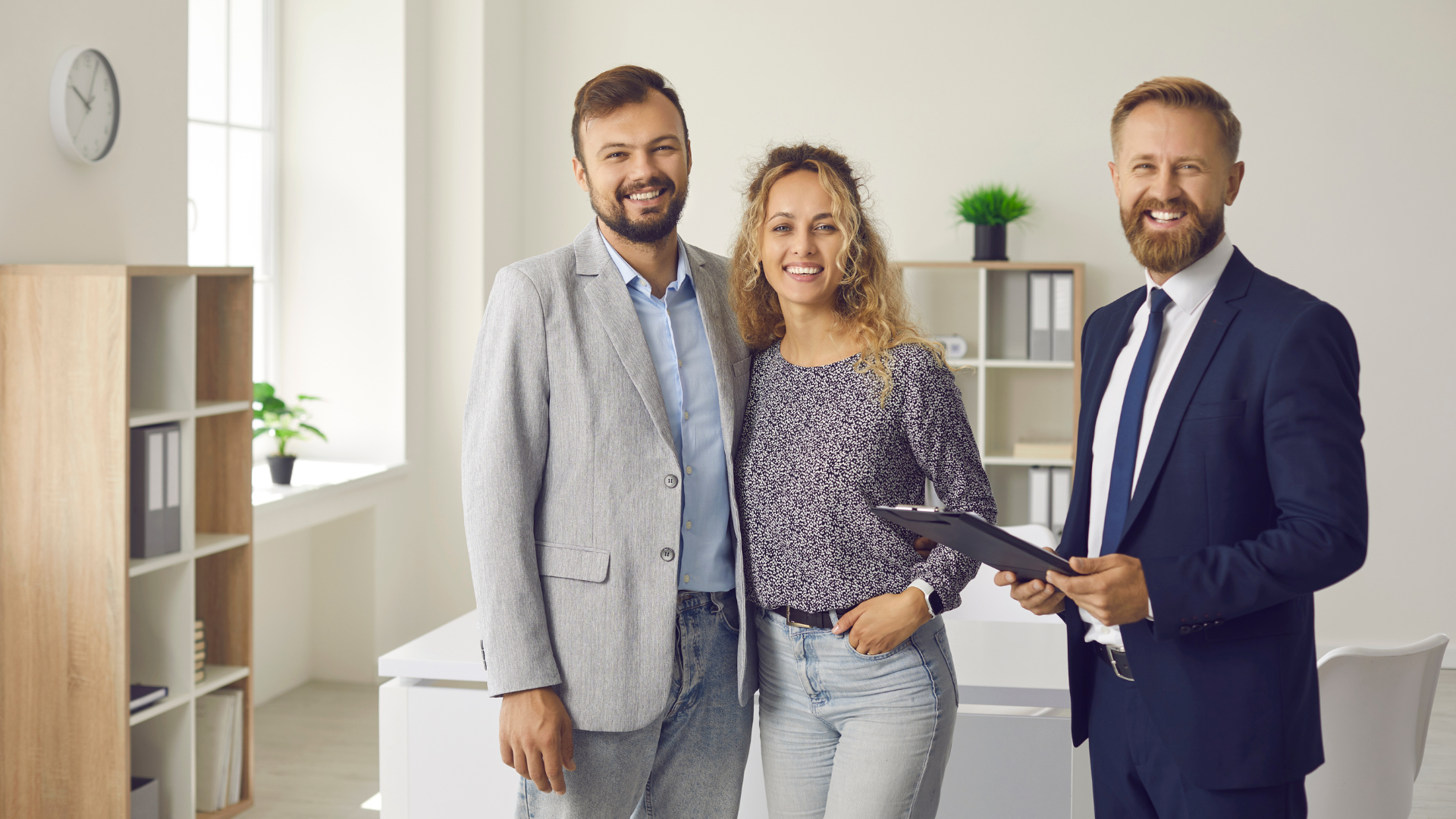 A man and a woman are standing next to each other in an office.