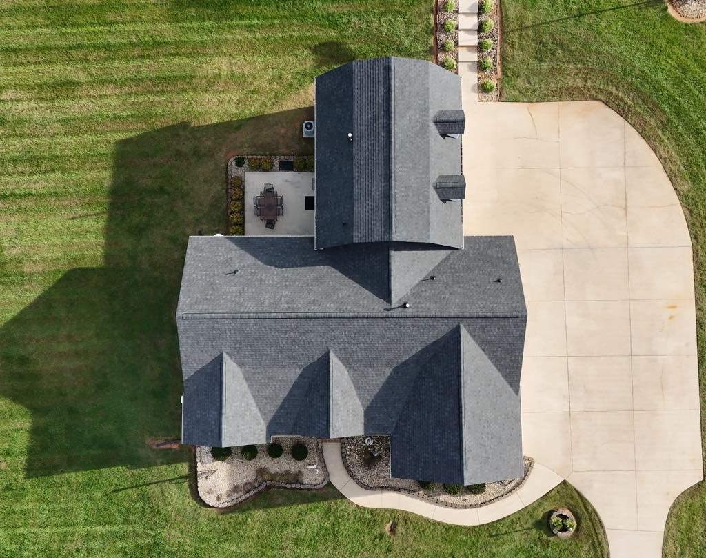 An aerial view of a house with a tiled roof.