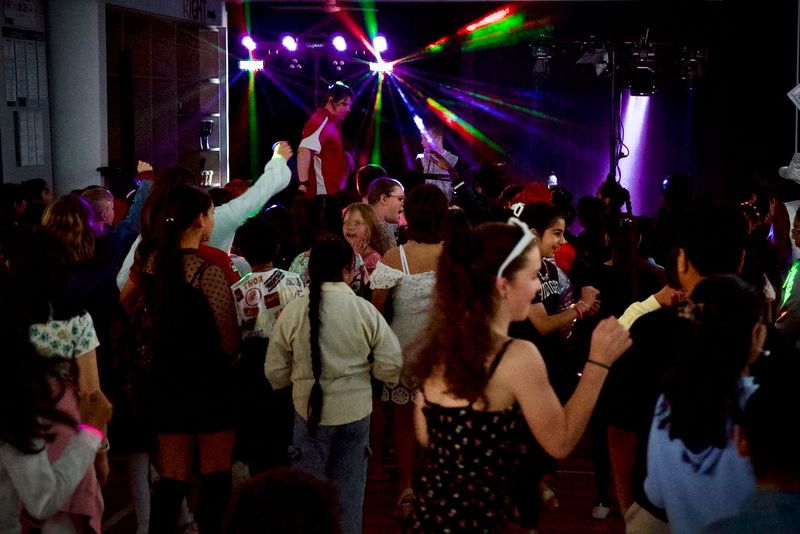 A group of children are dancing in a gym Box Hill