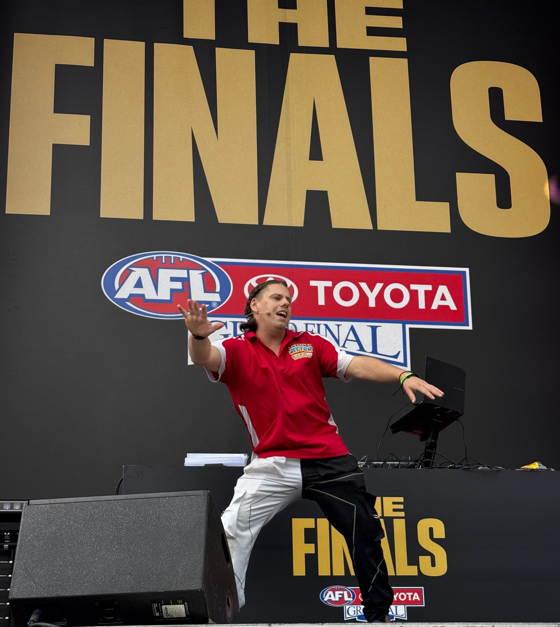 A silhouette of a dj wearing headphones playing music