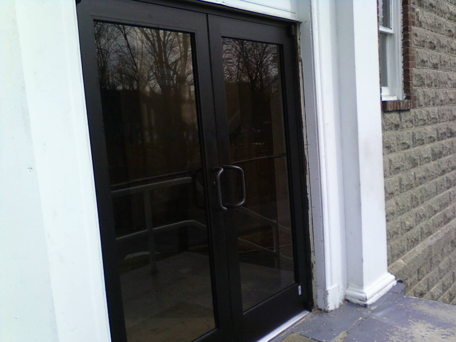 A pair of glass doors on the side of a building