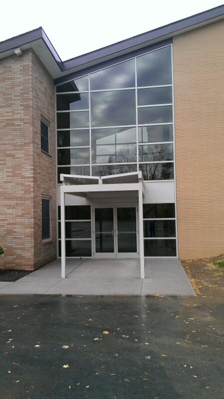 A large building with a lot of windows and doors