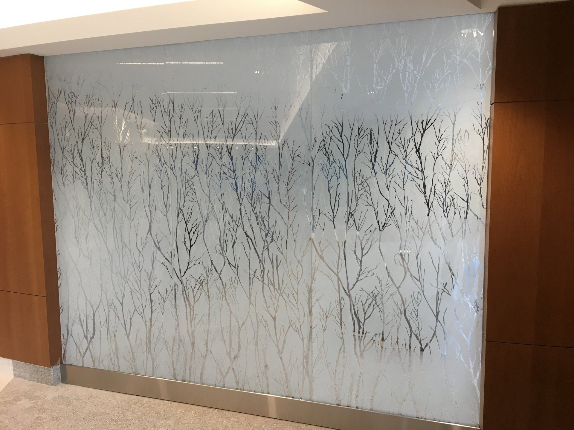 A wall with a picture of trees on it