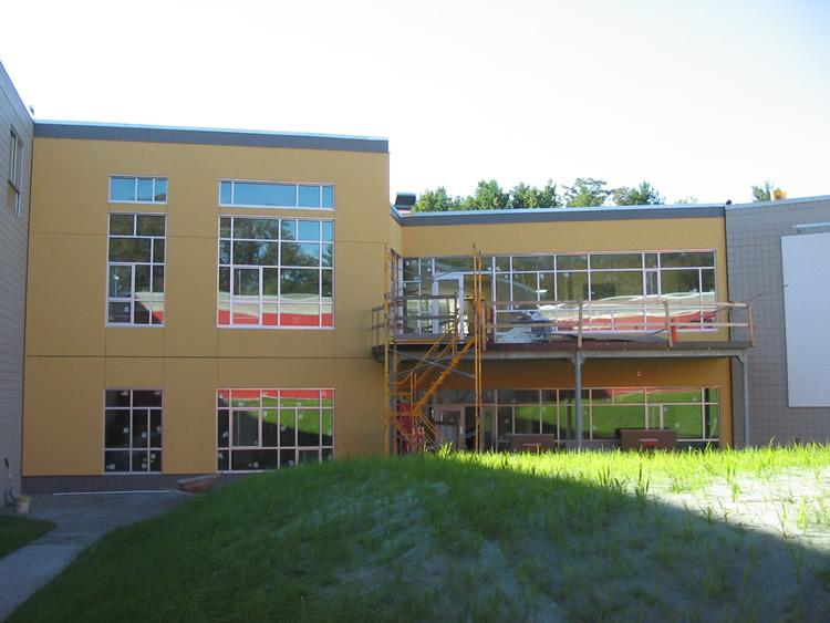 A large building with a lot of windows is under construction