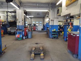 Mechanician changing car wheel - repair in Worcester, MA