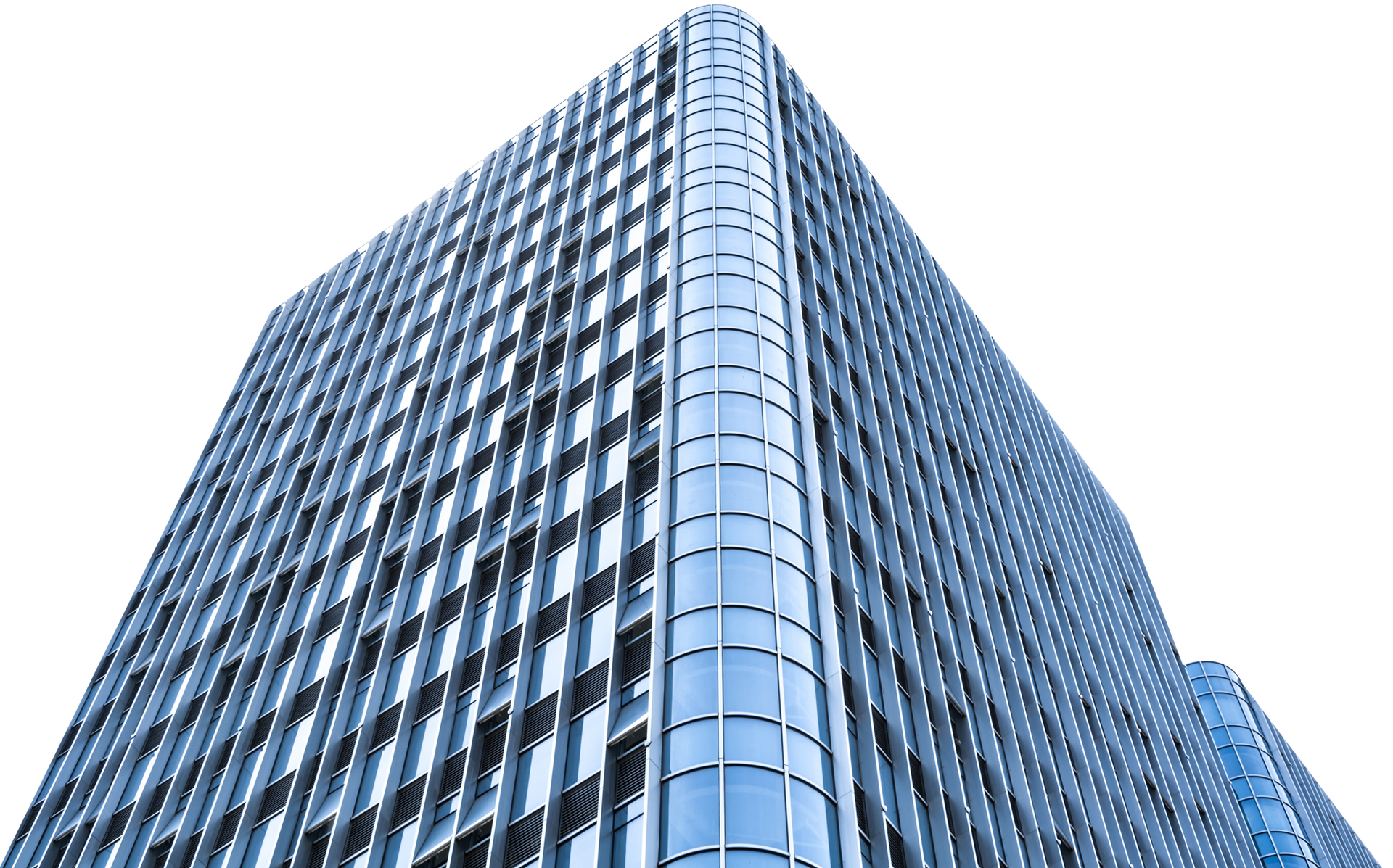 Tall, modern skyscraper with blue tinted windows, viewed from a low angle against a white sky.