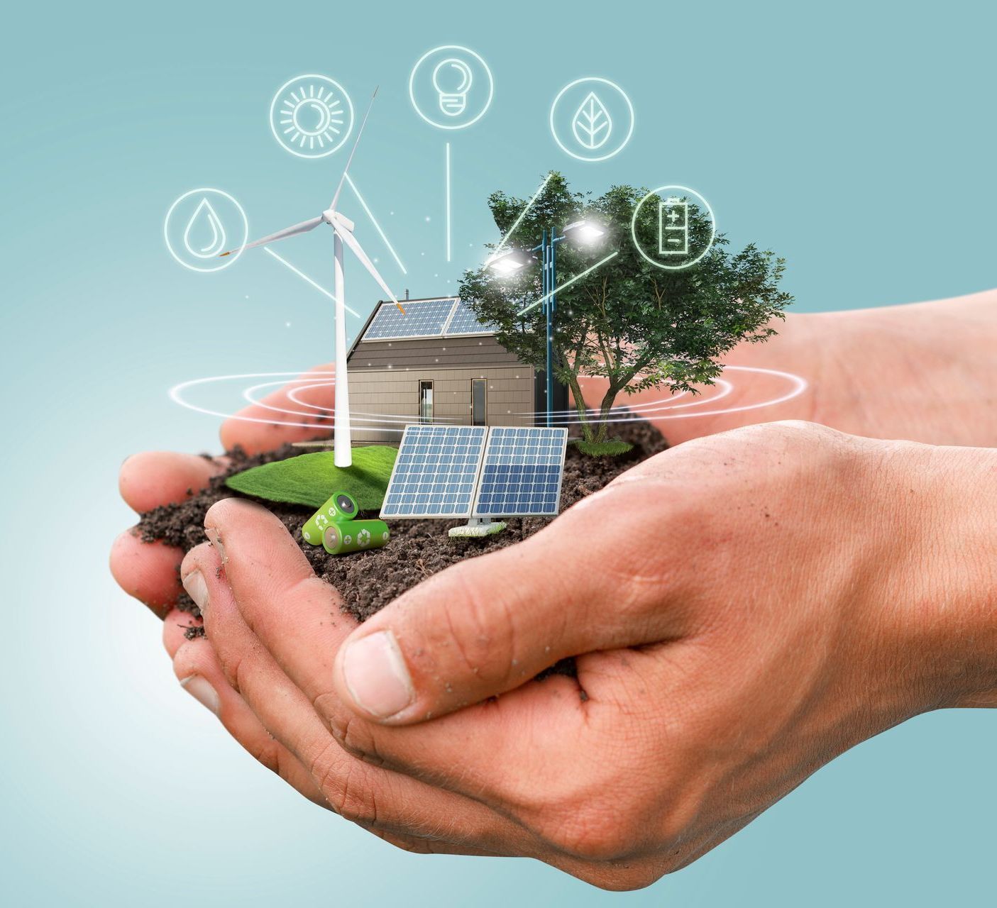 A person is holding a house with solar panels and windmills in their hands.
