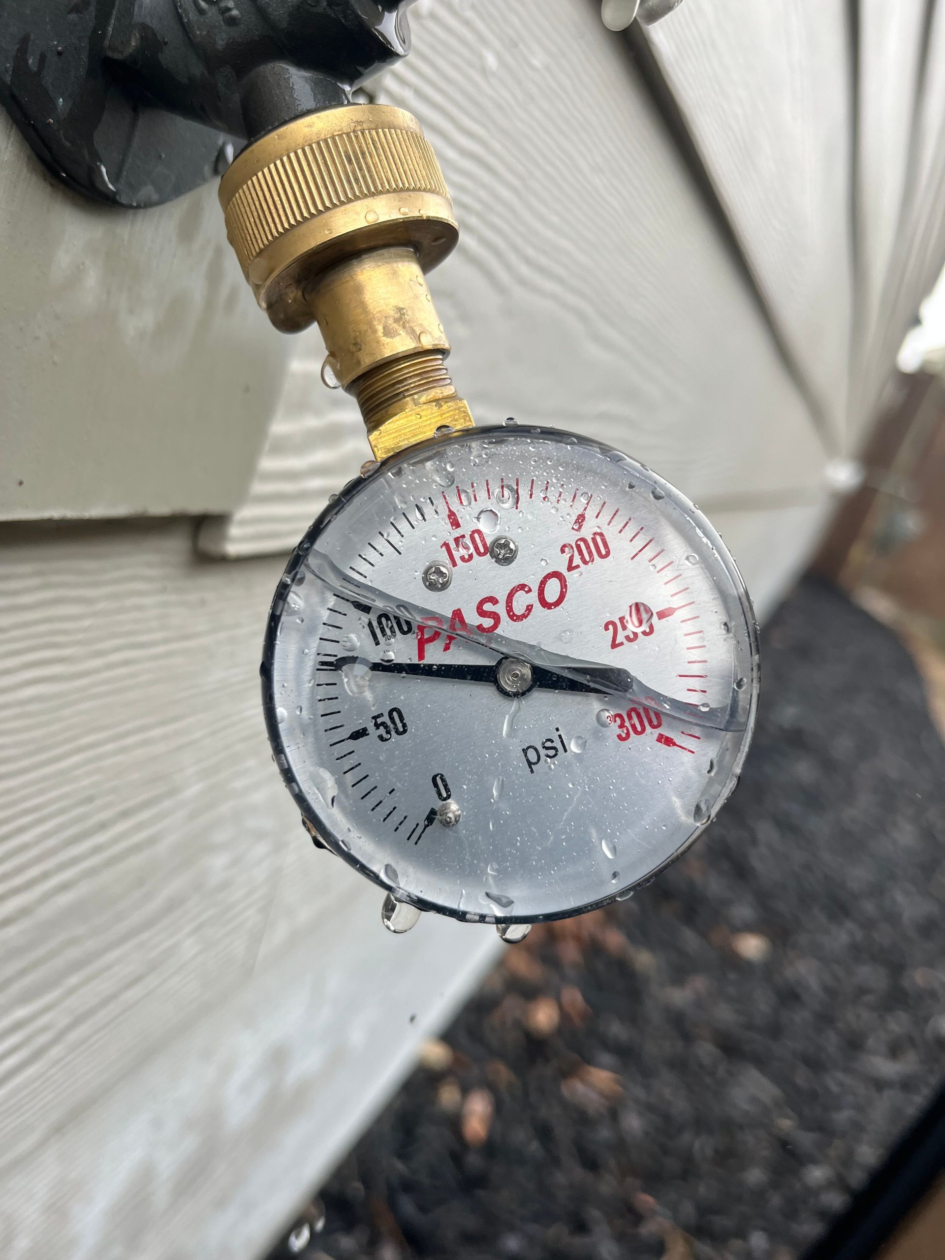 A pasco pressure gauge is attached to a pipe