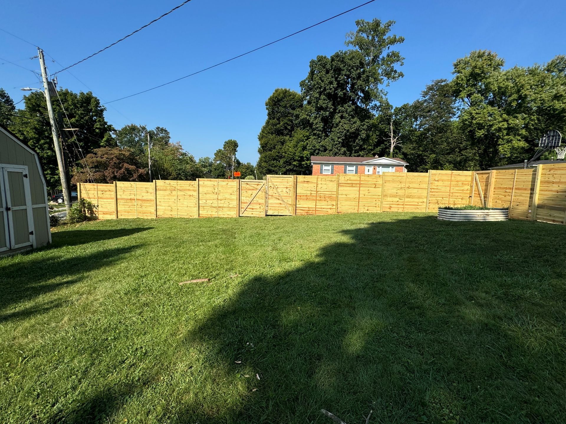 Backyard with Wooden Fence — Louisville, KY — Shatkoff Fencing