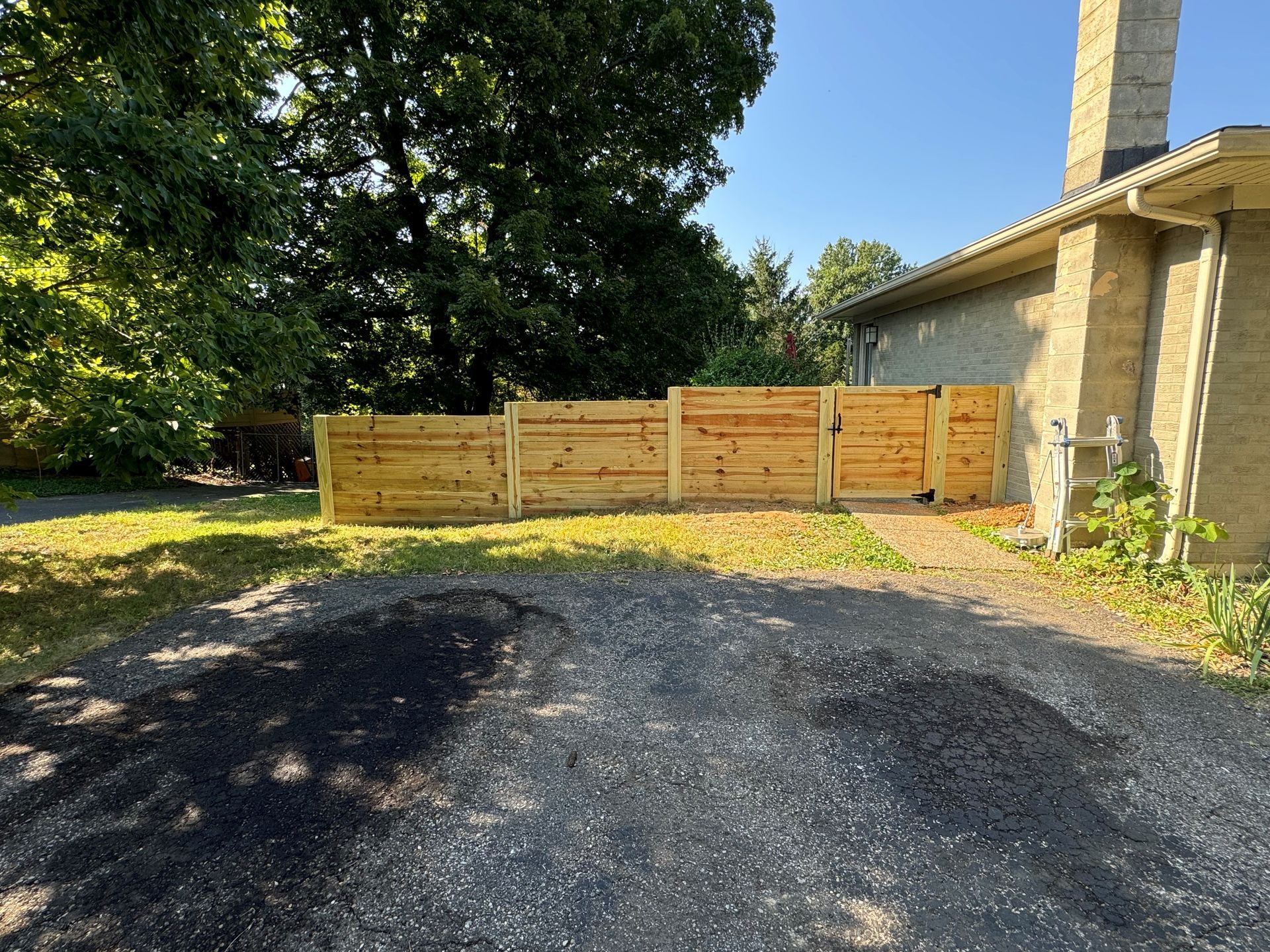 Driveway with Wooden Fence — Louisville, KY — Shatkoff Fencing