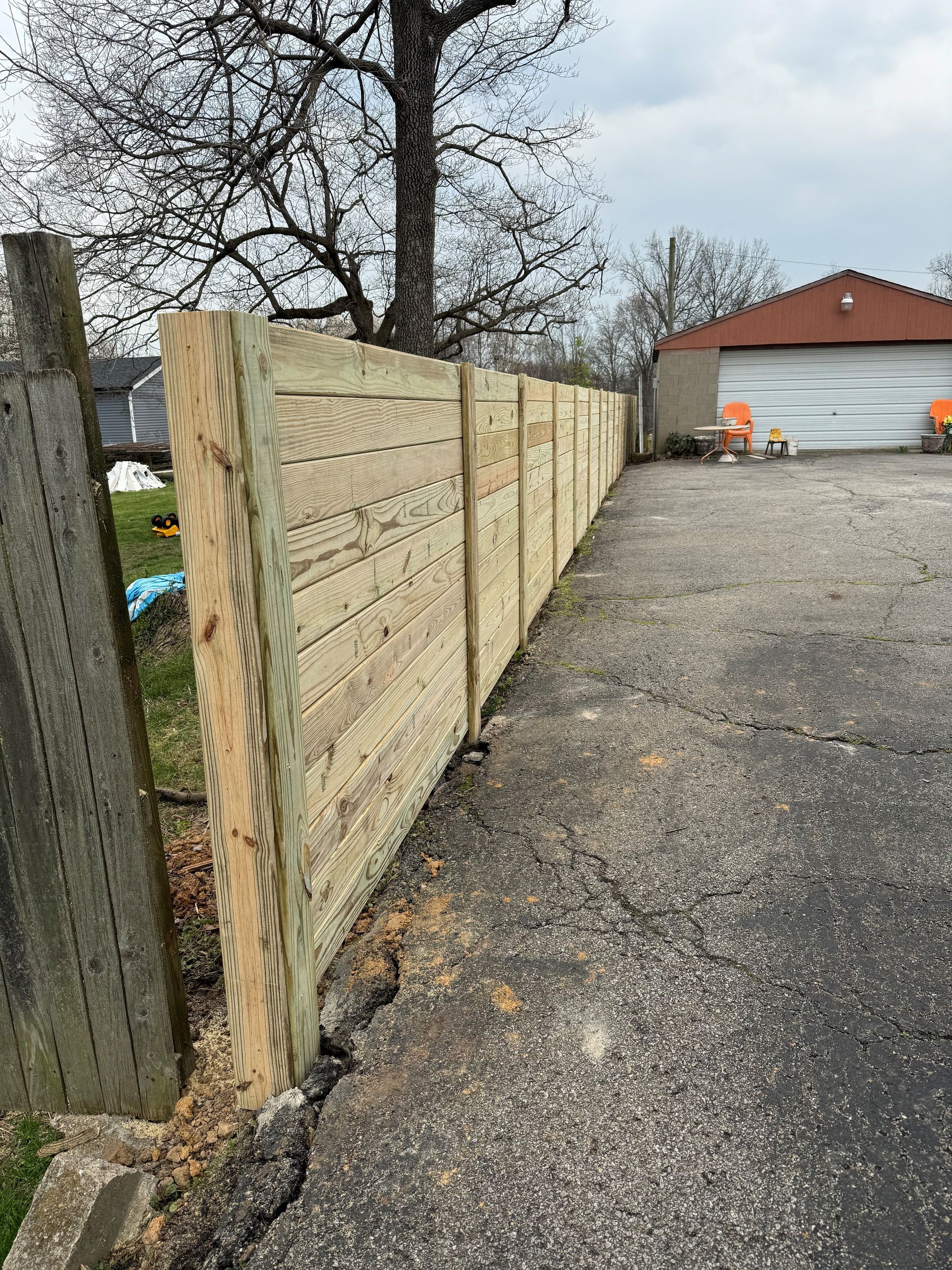 Wooden Fence Beside the Garage — Louisville, KY — Shatkoff Fencing