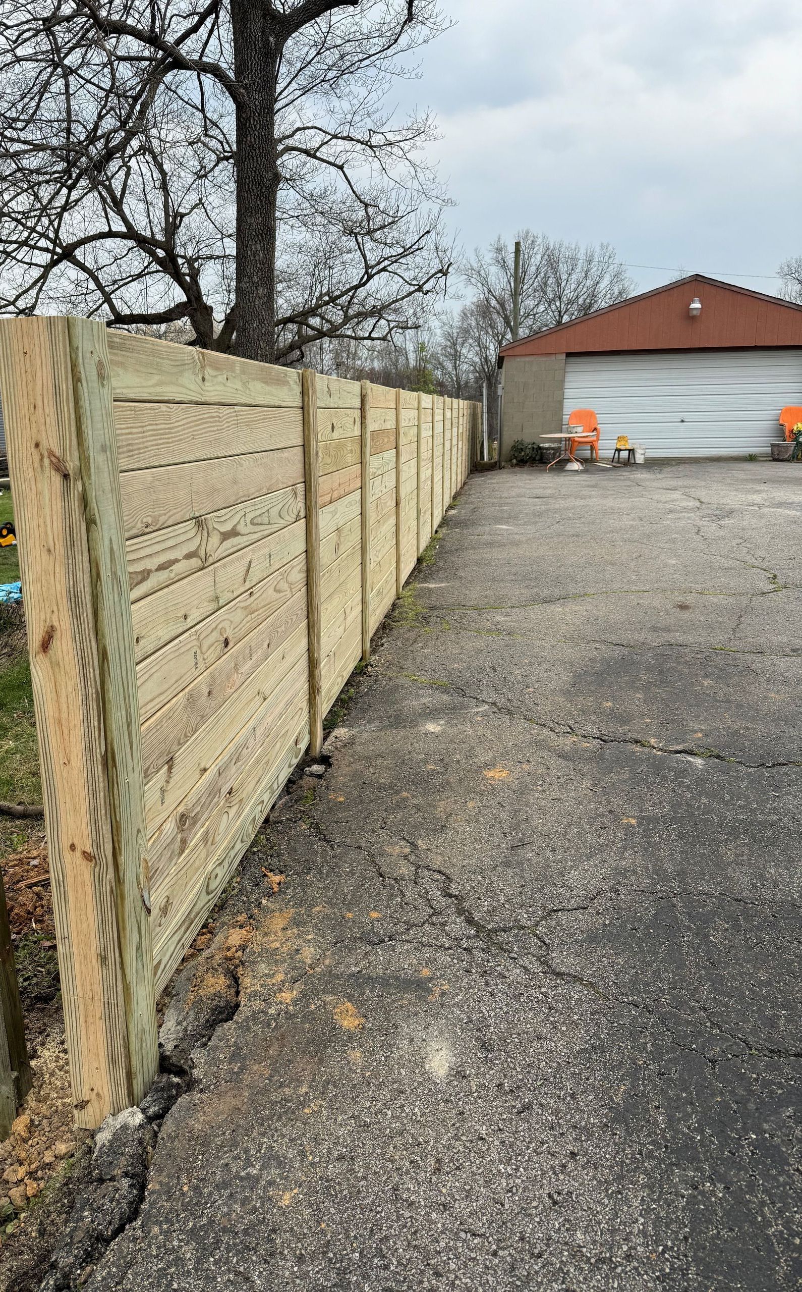 Wooden Fence Next to a Garage — Louisville, KY — Shatkoff Fencing