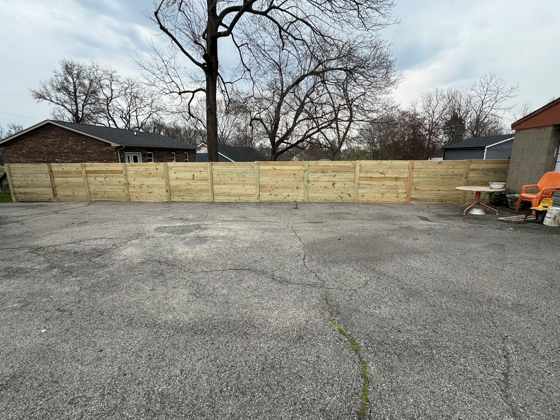 Fence in the Middle of a Gravel Lot — Louisville, KY — Shatkoff Fencing