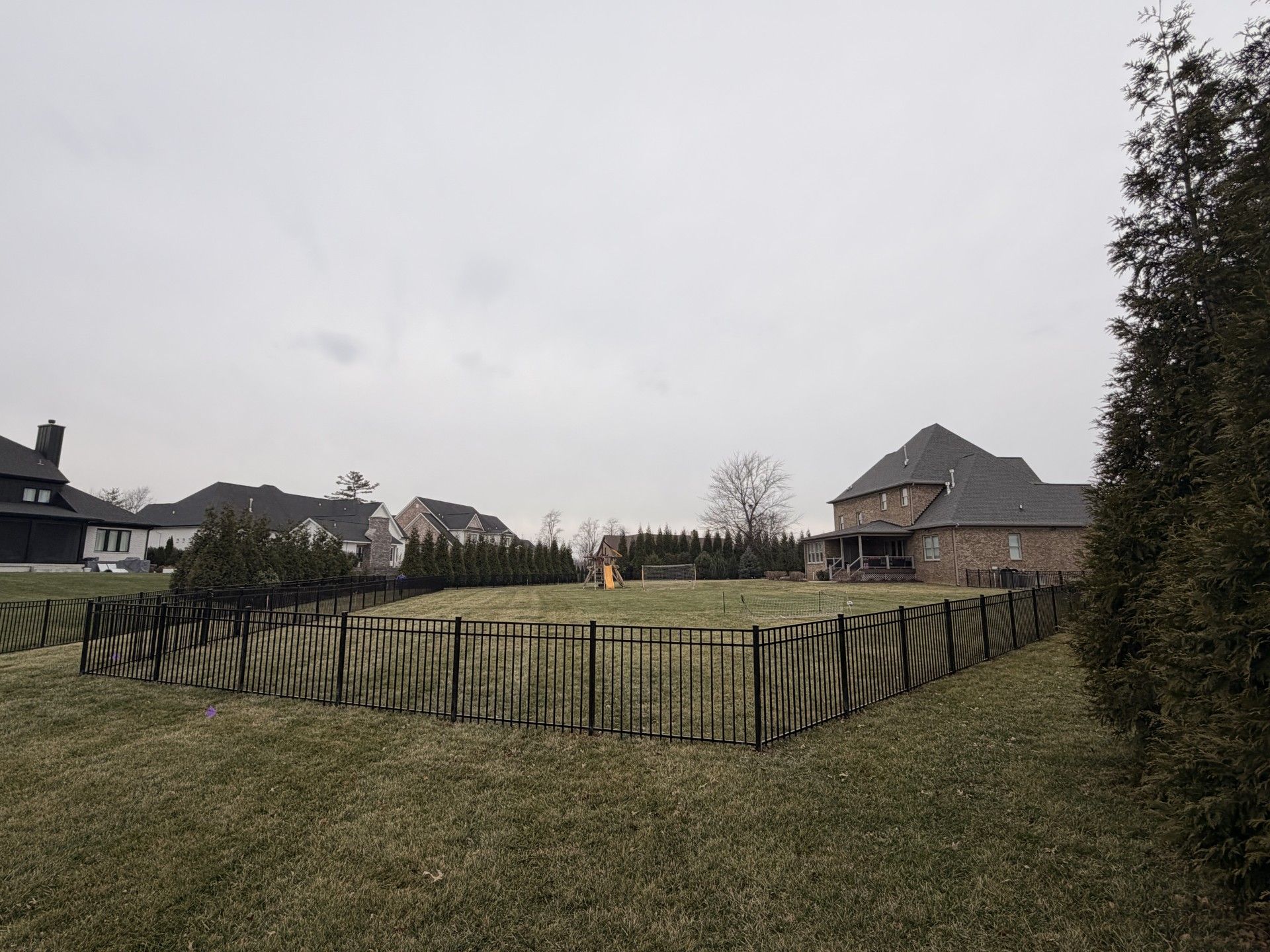 Wooden Fence Next to a Garage — Louisville, KY — Shatkoff Fencing