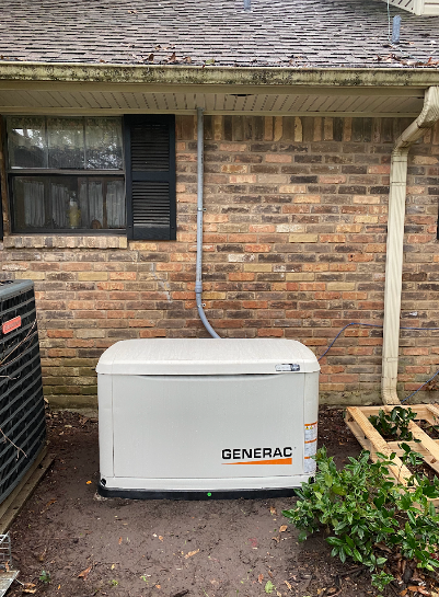 Generac generator against a brick wall, with a window and conduit above.