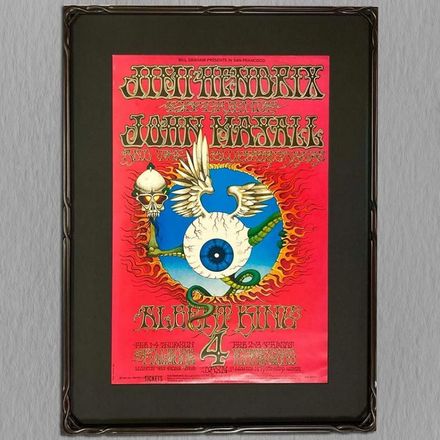 A framed poster for jimi hendrix featuring an eye and a snake