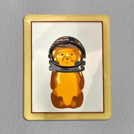 A picture of a gummy bear wearing a space helmet