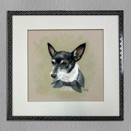 A framed painting of a small black and white dog wearing a bow tie.