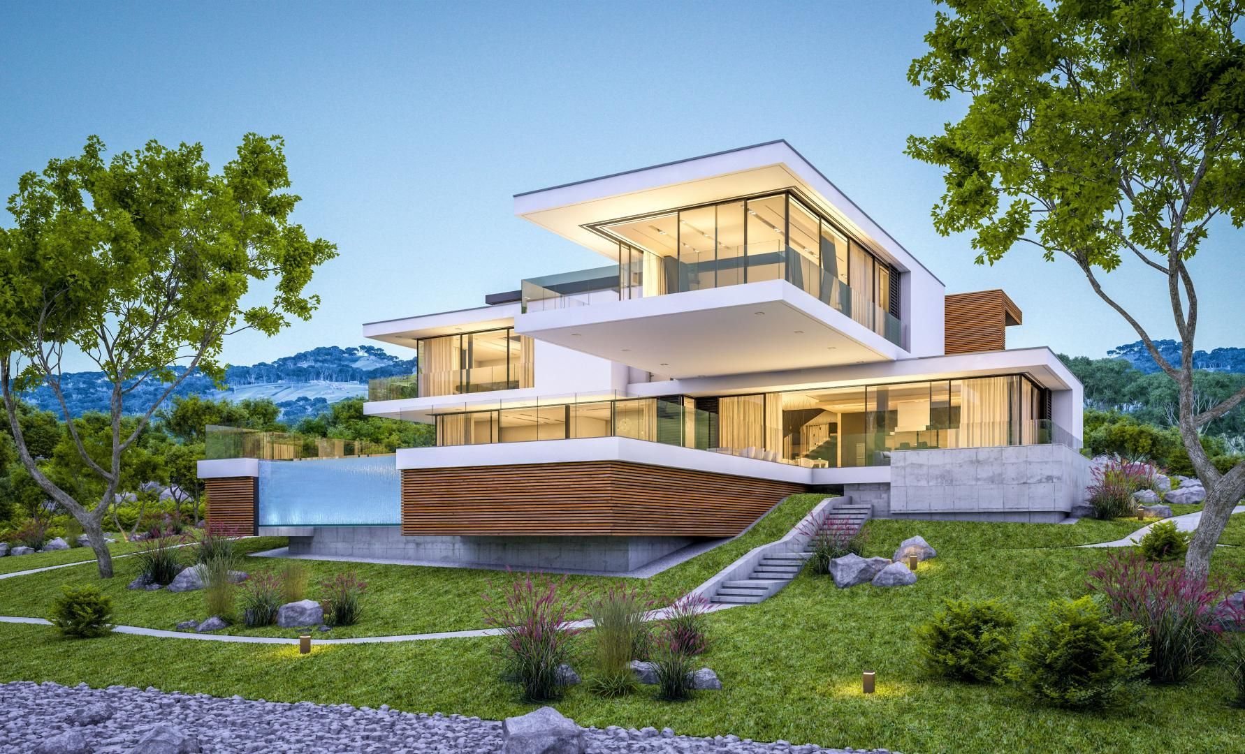 Une maison moderne est située au sommet d'une colline verdoyante entourée d'arbres.