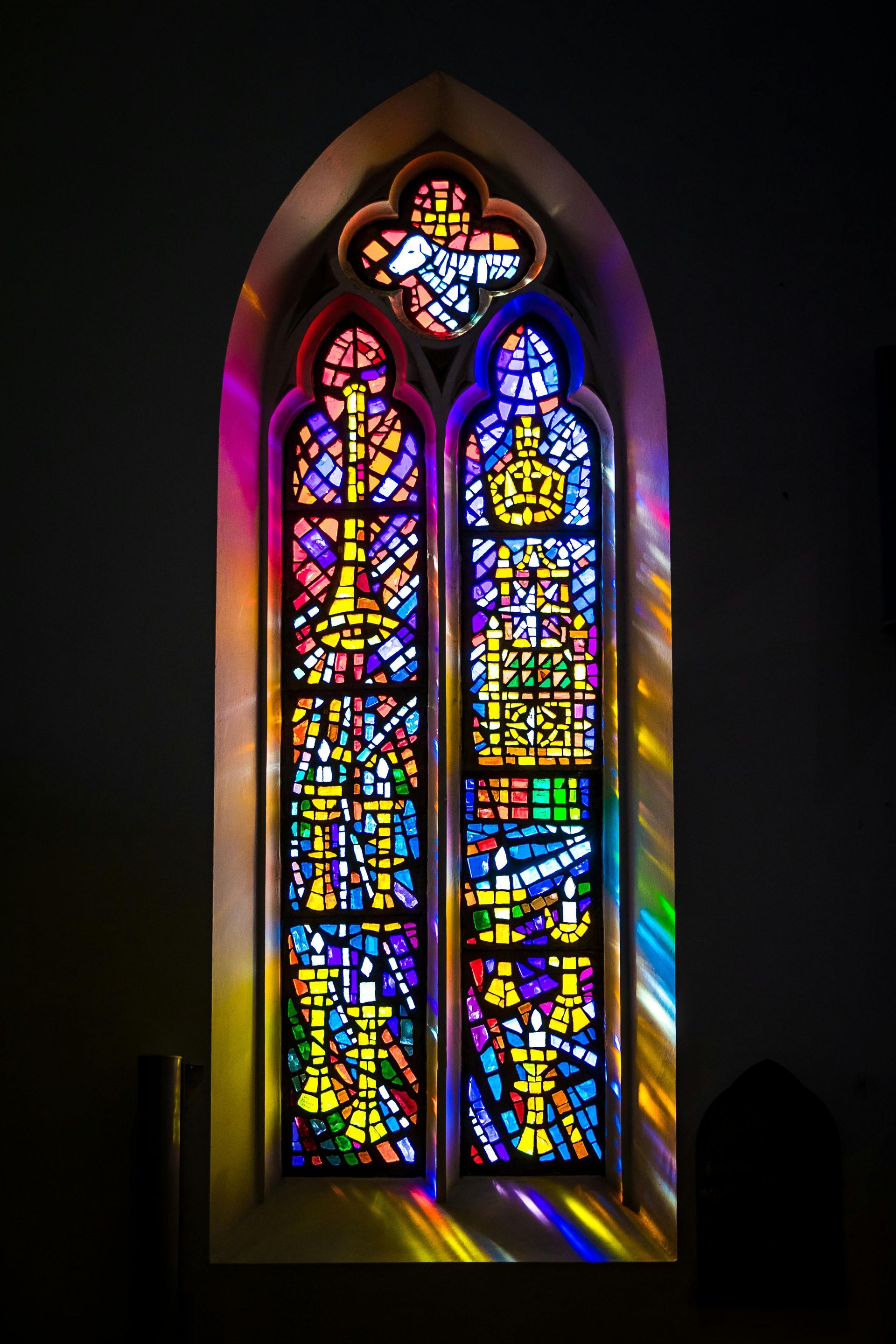 A colorful stained glass window in a church