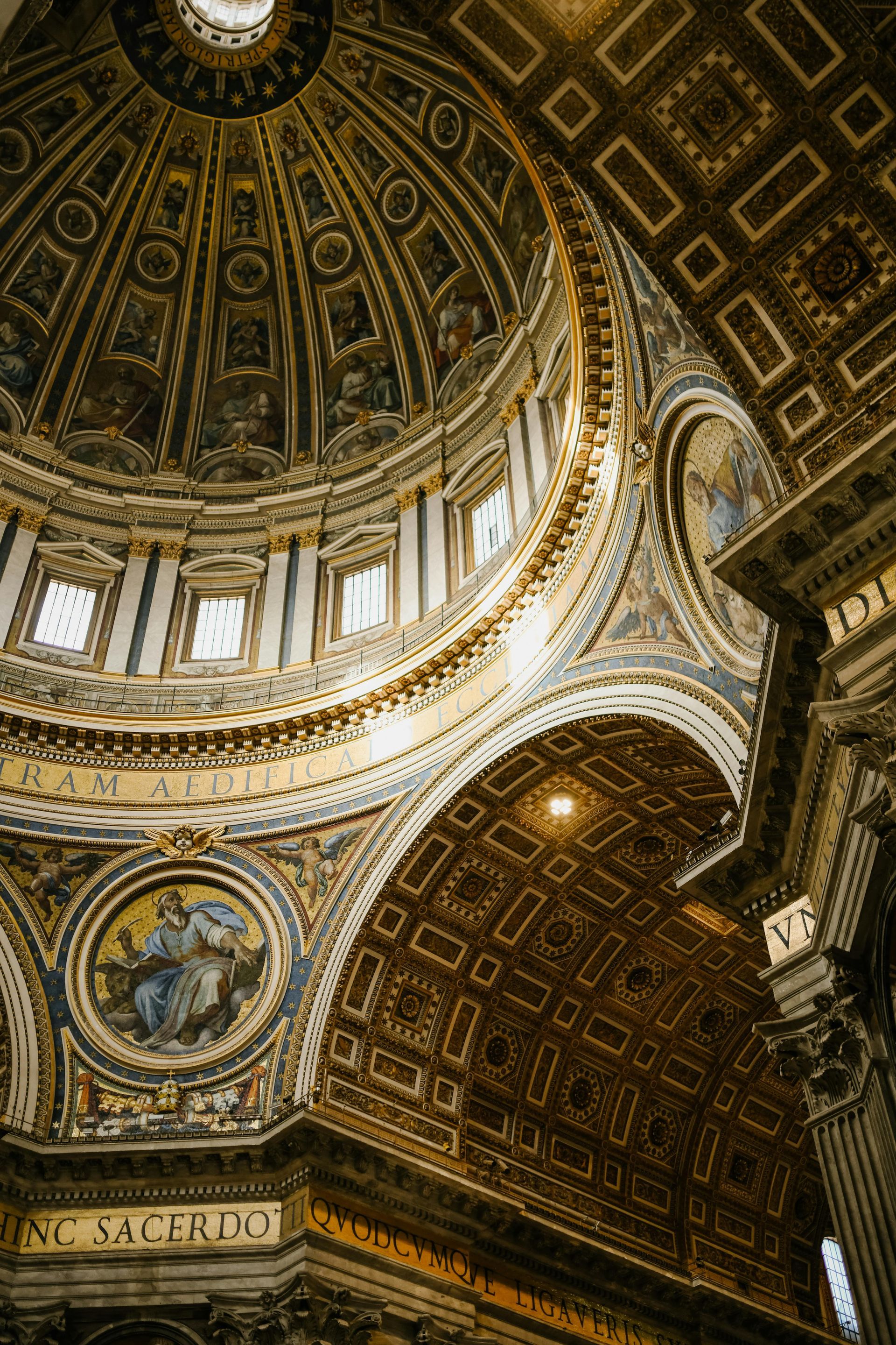 The inside of a church with a dome and columns.