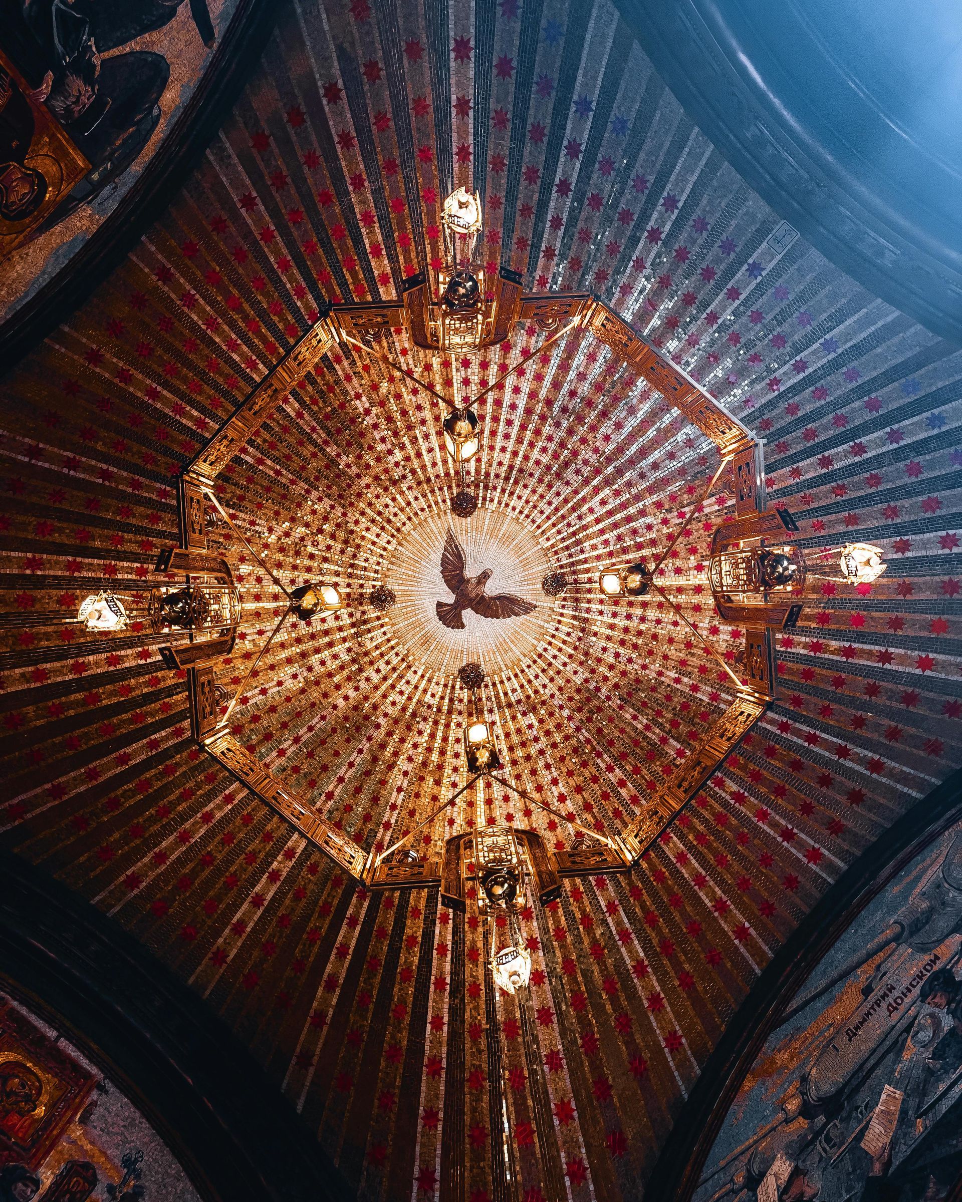 A chandelier is hanging from the ceiling of a building
