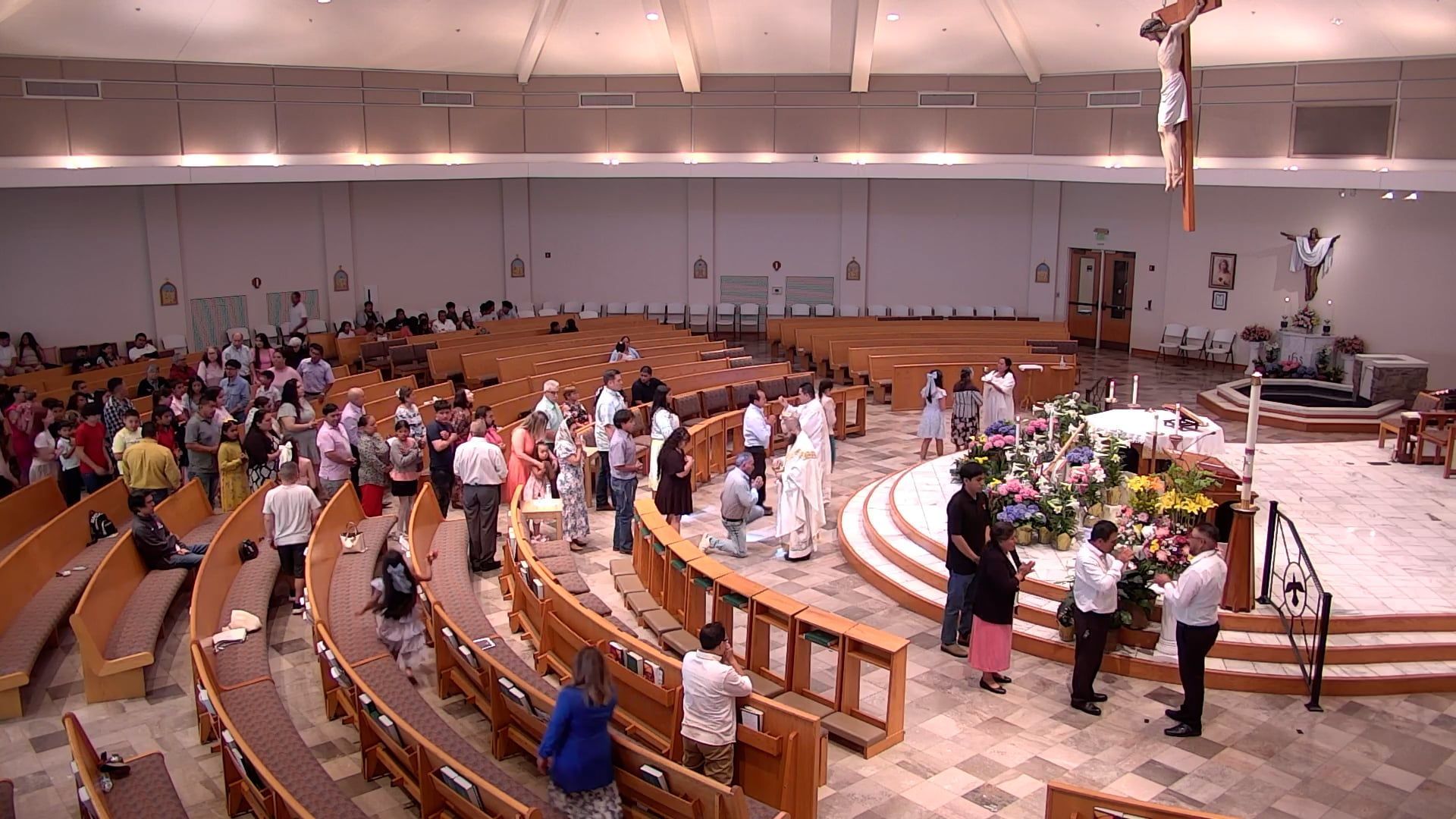 Fr. Joe and Deacon Renzo distributing Holy Communion to parishioners in the church. 
