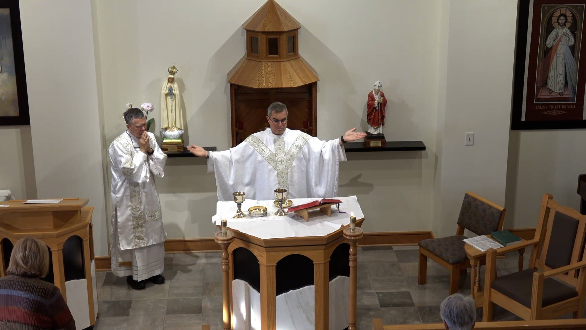 Fr. Pete celebrating mass in the chapel with Deacon Renzo. 