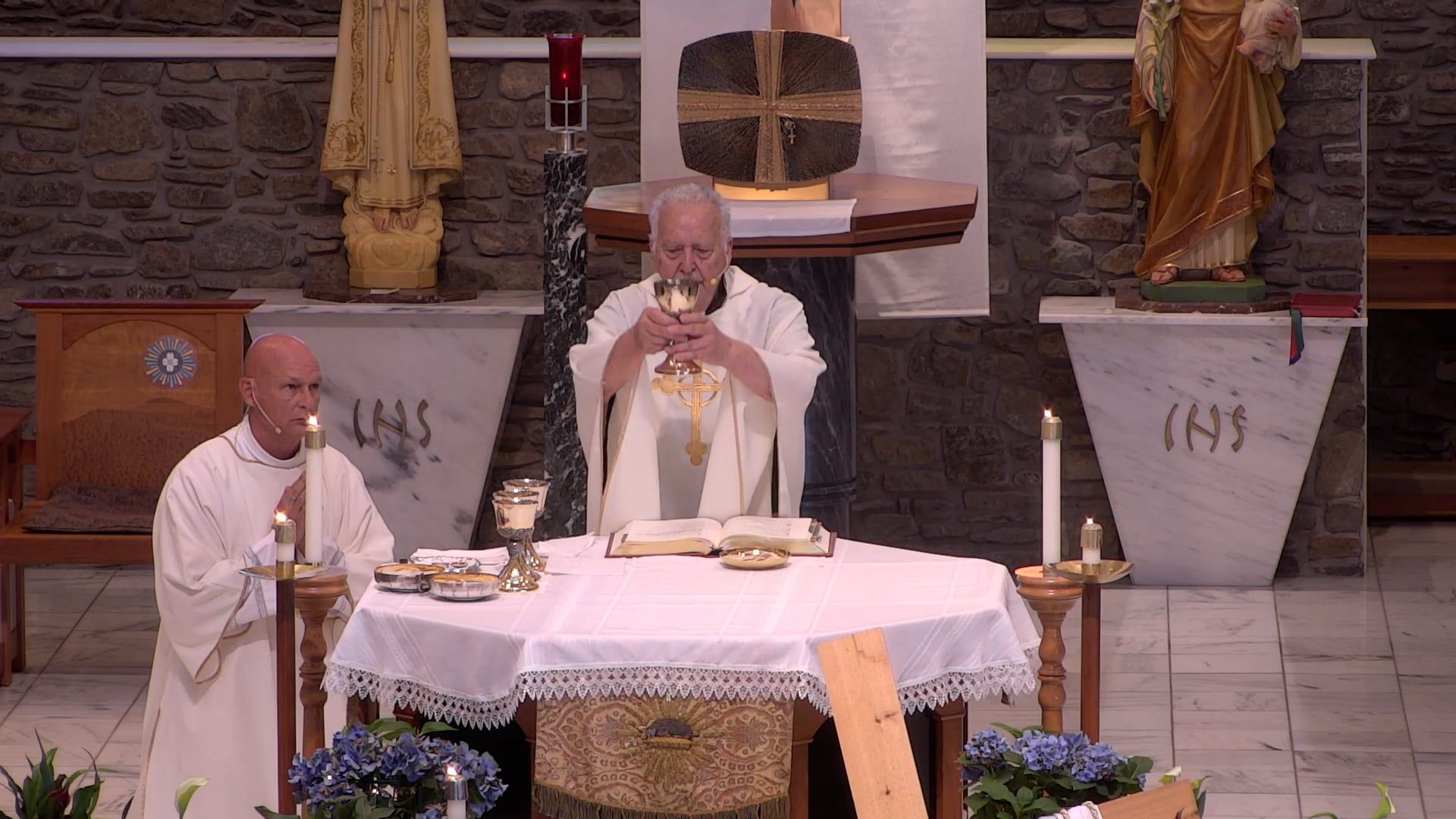  Rev. Jerome Hackenmueller celebrating mass in the main church with Dcn. Bill