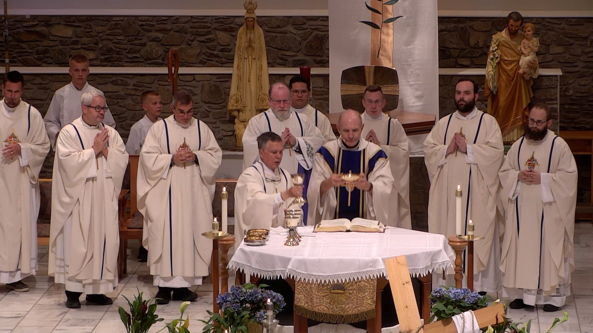 Bishop Mark Beckman celebrating mass in the main church with multiple clergy