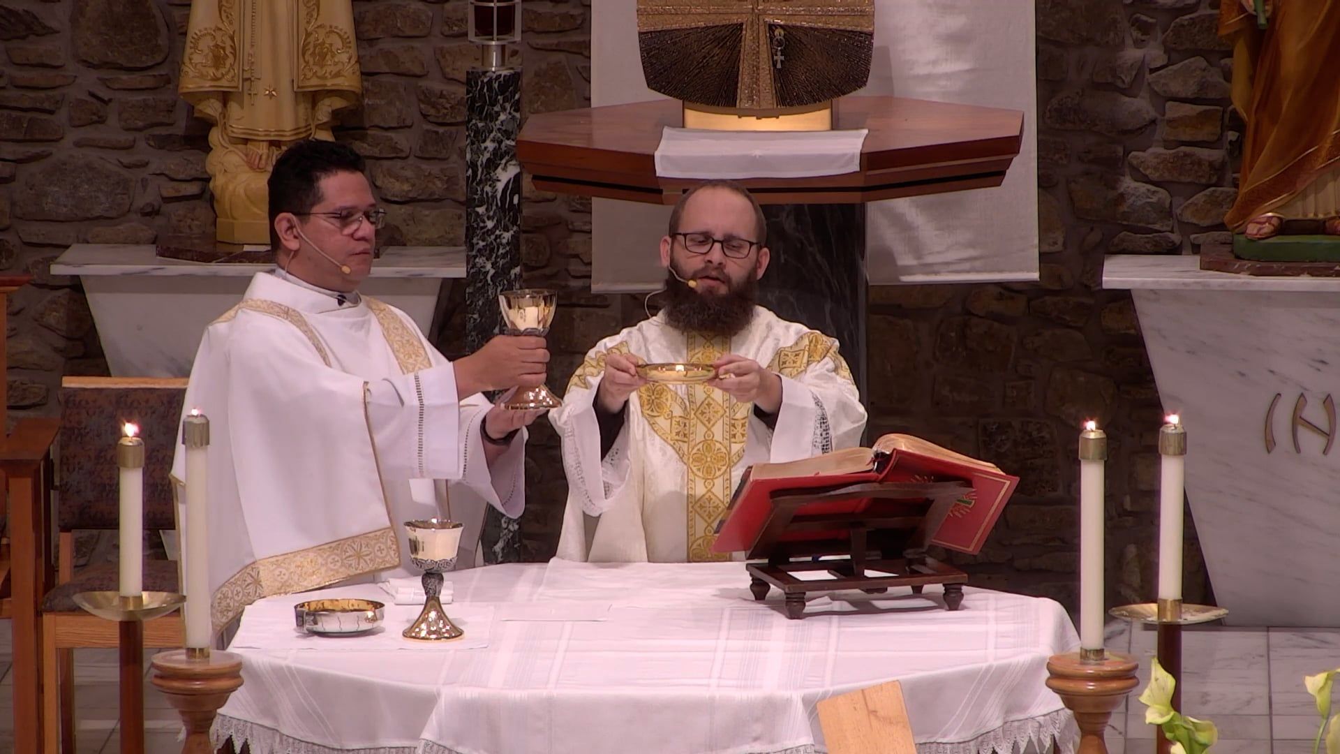 Fr. Joe and Deacon Renzo on an altar celebrating mass