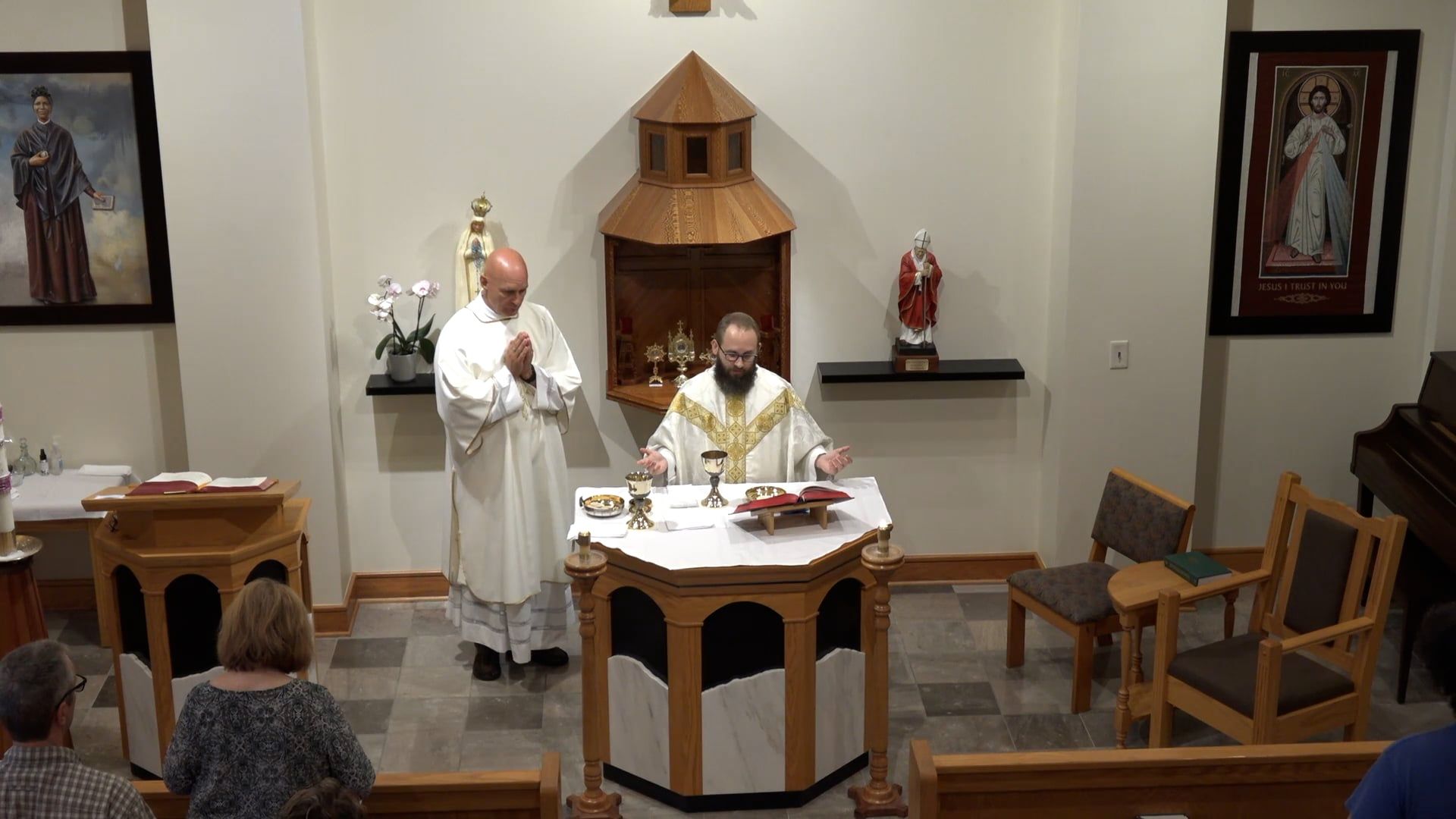 Fr. Joe and Deacon Bill at the alter of the chapel celebrating mass. 