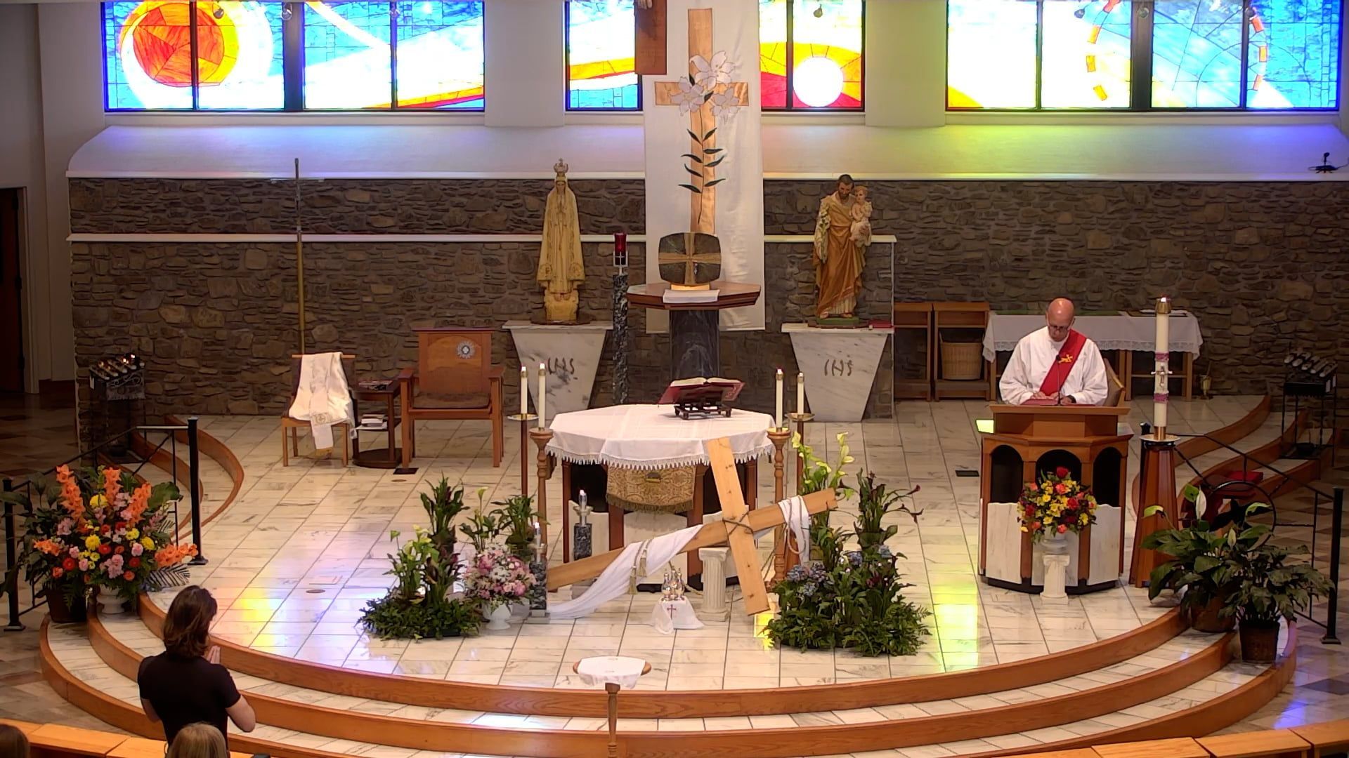 Deacon Bill at the altar of the main church celebrating a communion service. 