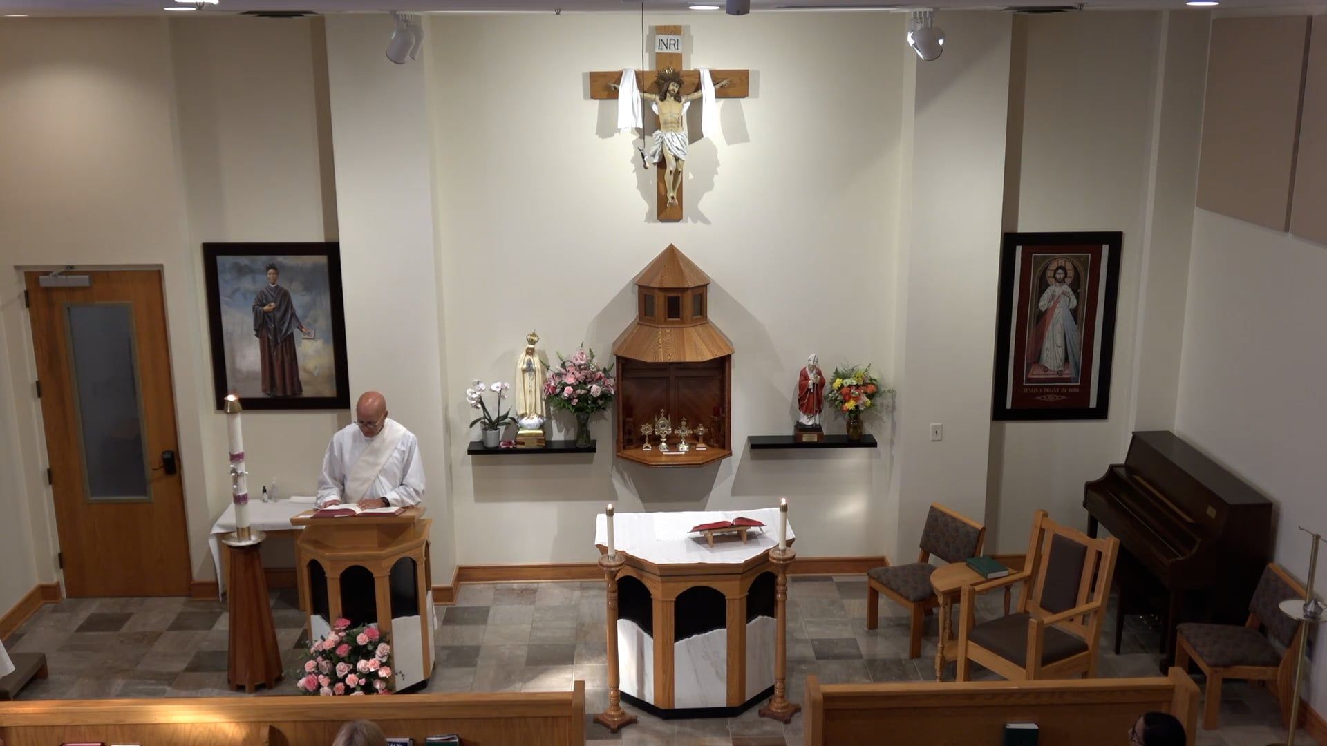 Deacon Bill celebrating a communion service in the chapel. 