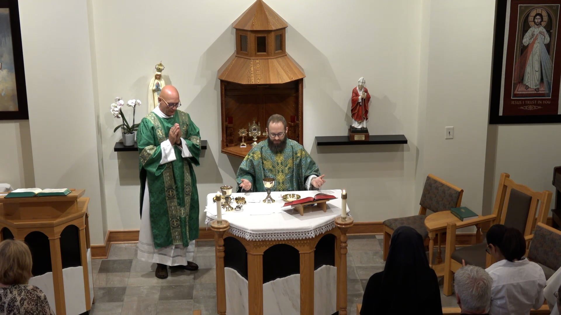 Father Joe and Deacon Bill at the altar in the chapel. 