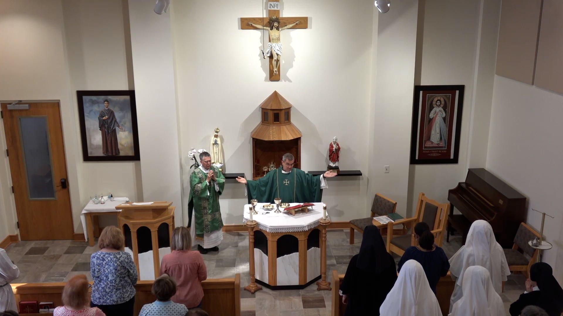 Father Pete and Deacon Leon celebrating mass in the chapel. 