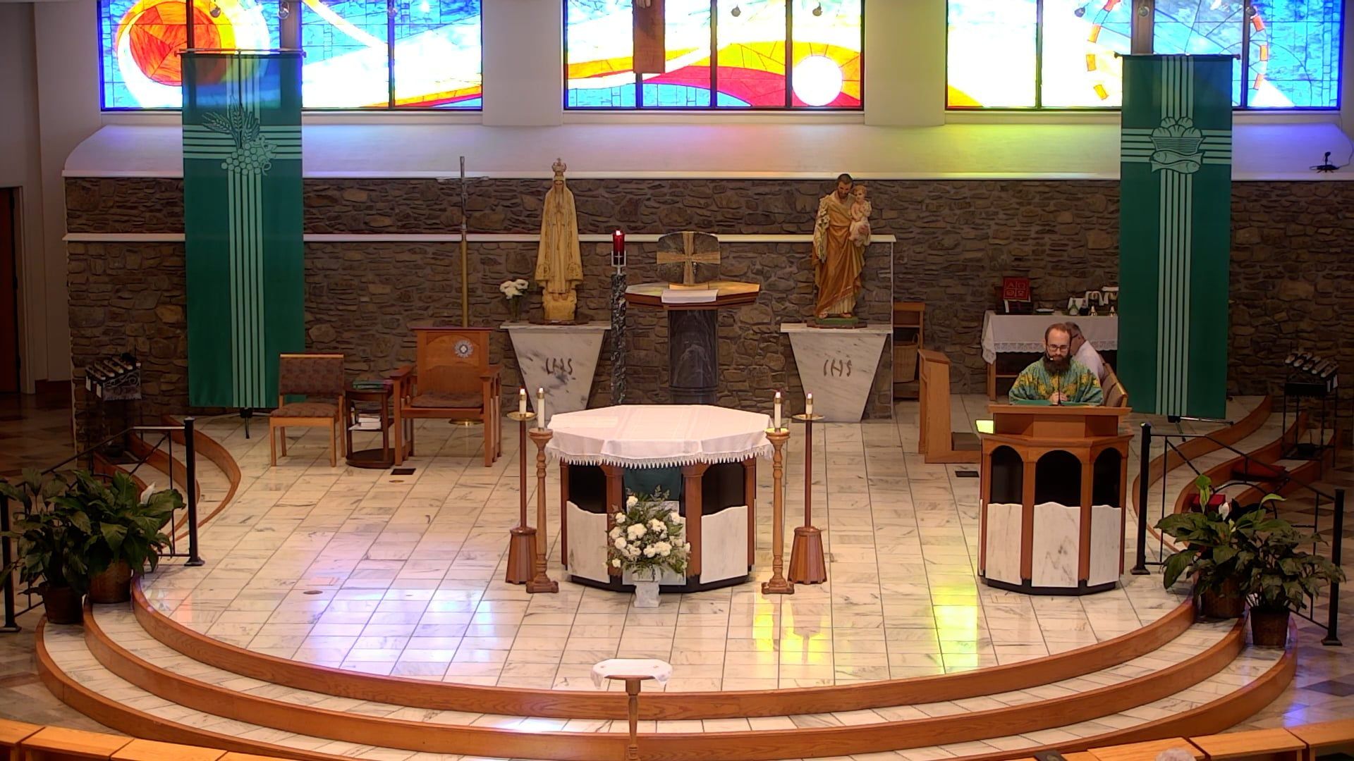 Fr. Joe at the ambo in the main church celebrating mass