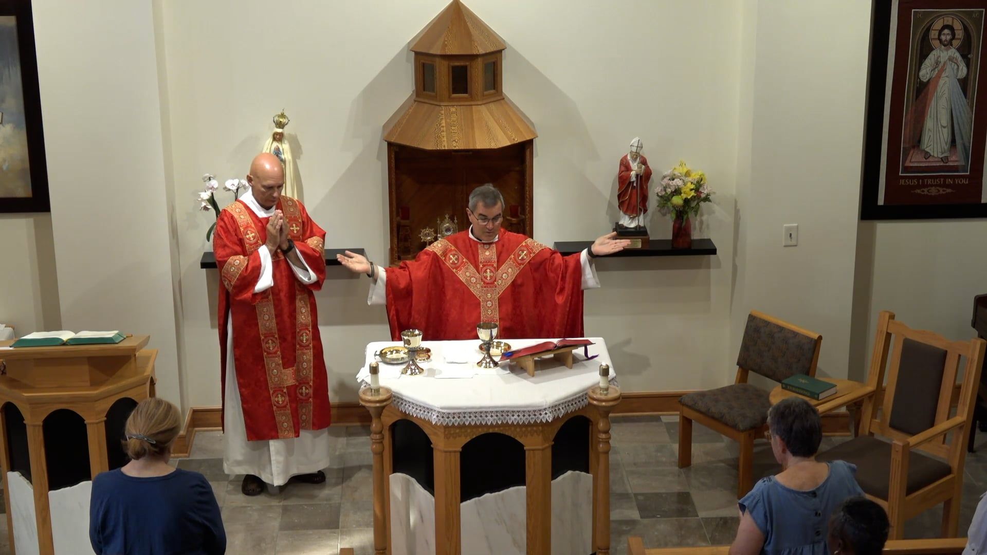 Fr. Pete and Deacon Bill standing at the the altar in the chapel.