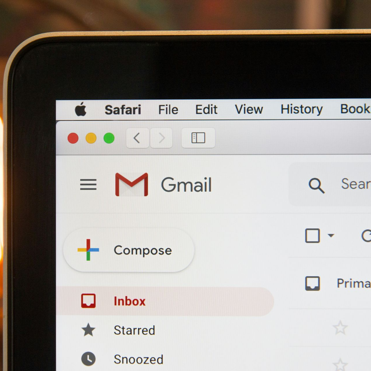 Gmail inbox open on a laptop screen, showing options like