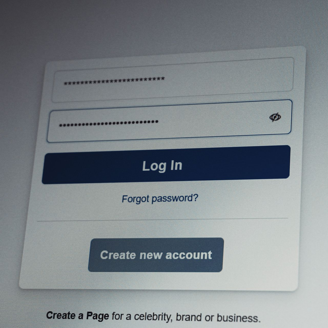 Facebook login screen with email/phone and password fields,