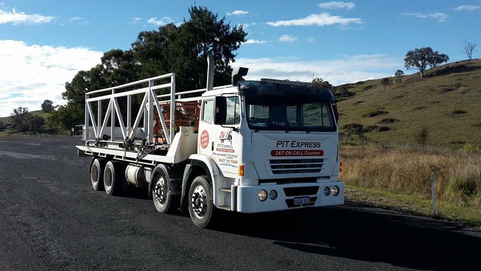A White Truck Is Parked On The Side Of The Road — Pit Express in Singleton, NSW