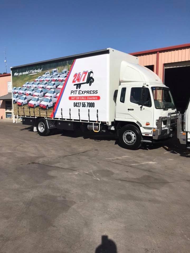 White Moving Truck is Parked in a Parking Lot in Front of a Building — Pit Express in Gold Coast, QLD