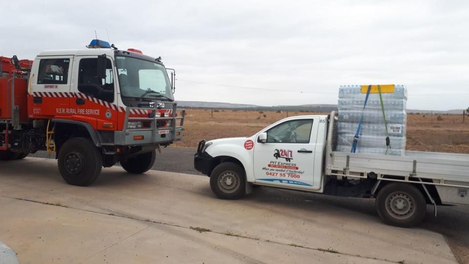 Fire Truck and a White Truck Are Parked Next to Each Other — Pit Express in Botany, NSW
