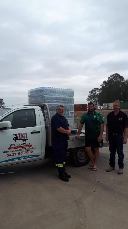 Two Men Are Shaking Hands in Front of a Truck — Pit Express in Tamworth, NSW